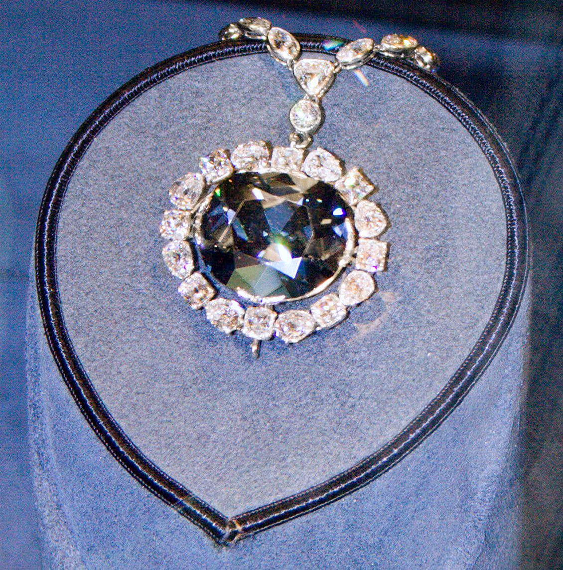 The Hope Diamond surrounded by white diamonds in its necklace setting