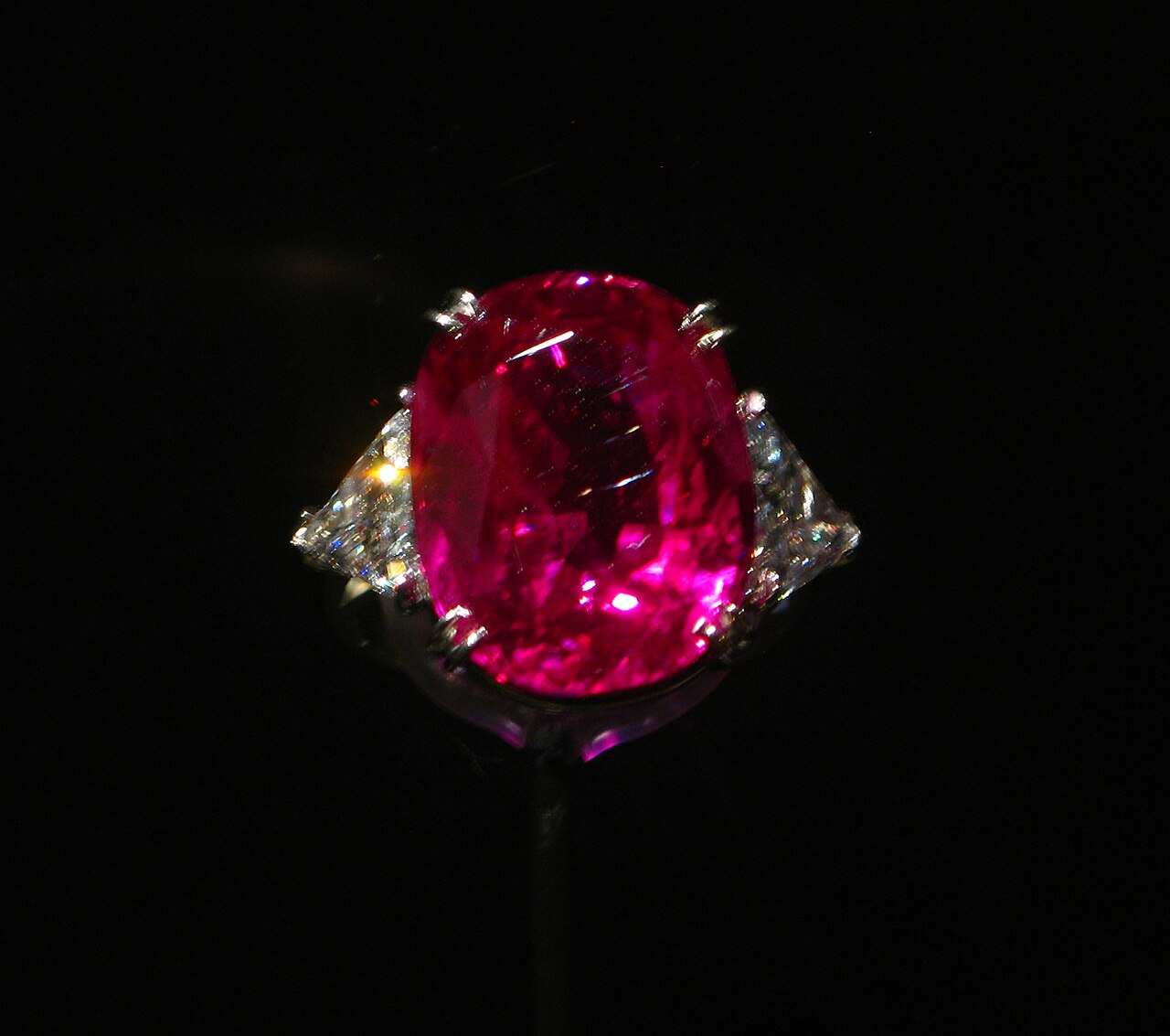 The vivid red Carmen Lúcia Ruby set in a ring against a dark background